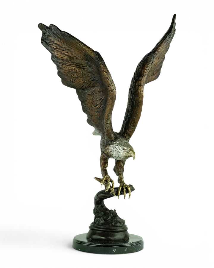 Bronze sculpture of a fishing eagle with wings spread
