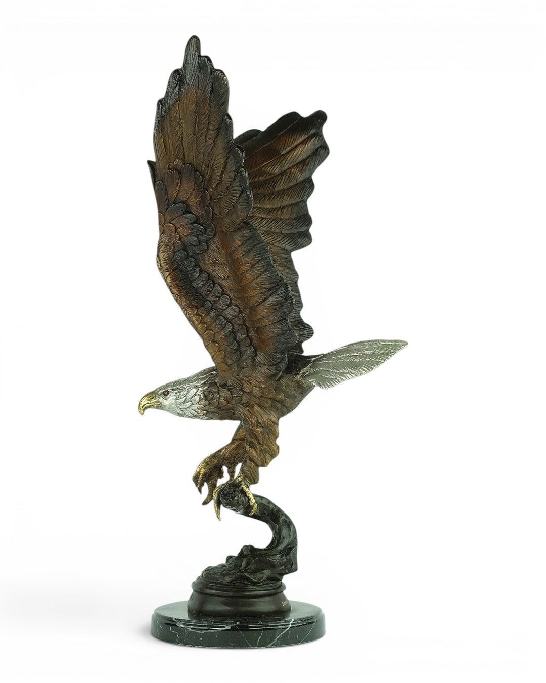 Bronze sculpture of a fishing eagle with wings spread