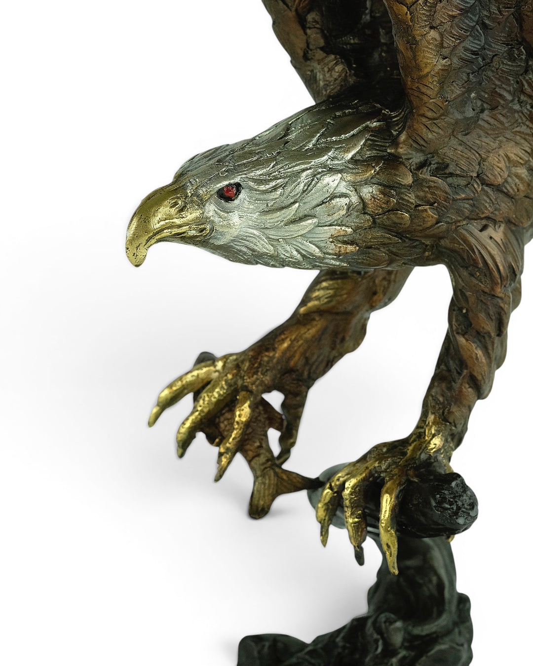 Bronze sculpture of a fishing eagle with wings spread
