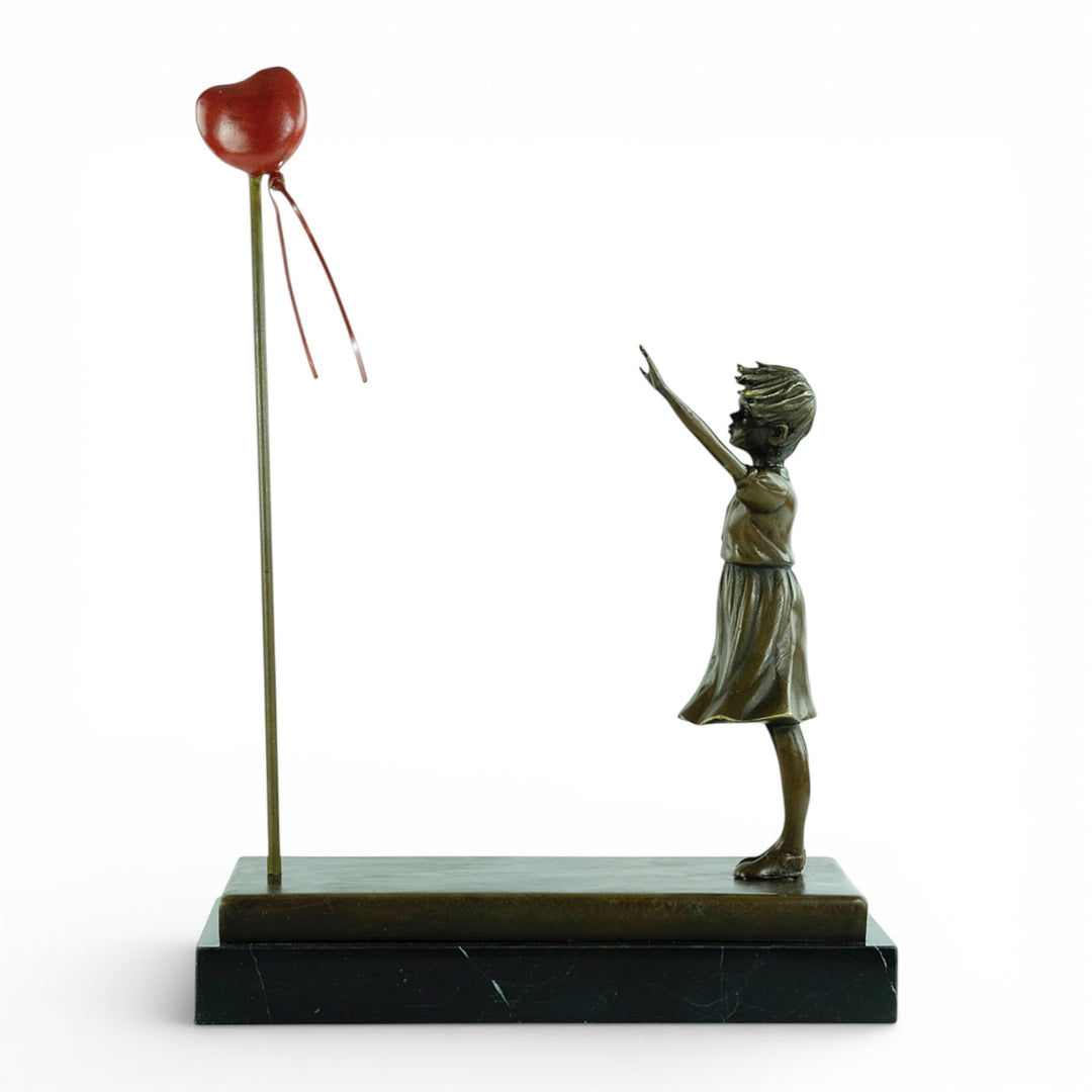 Bronze girl with balloon sculpture – inspired by Banksy