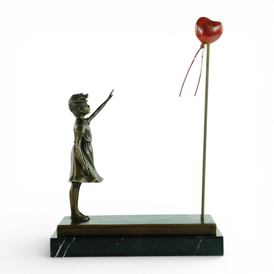 Bronze girl with balloon sculpture – inspired by Banksy