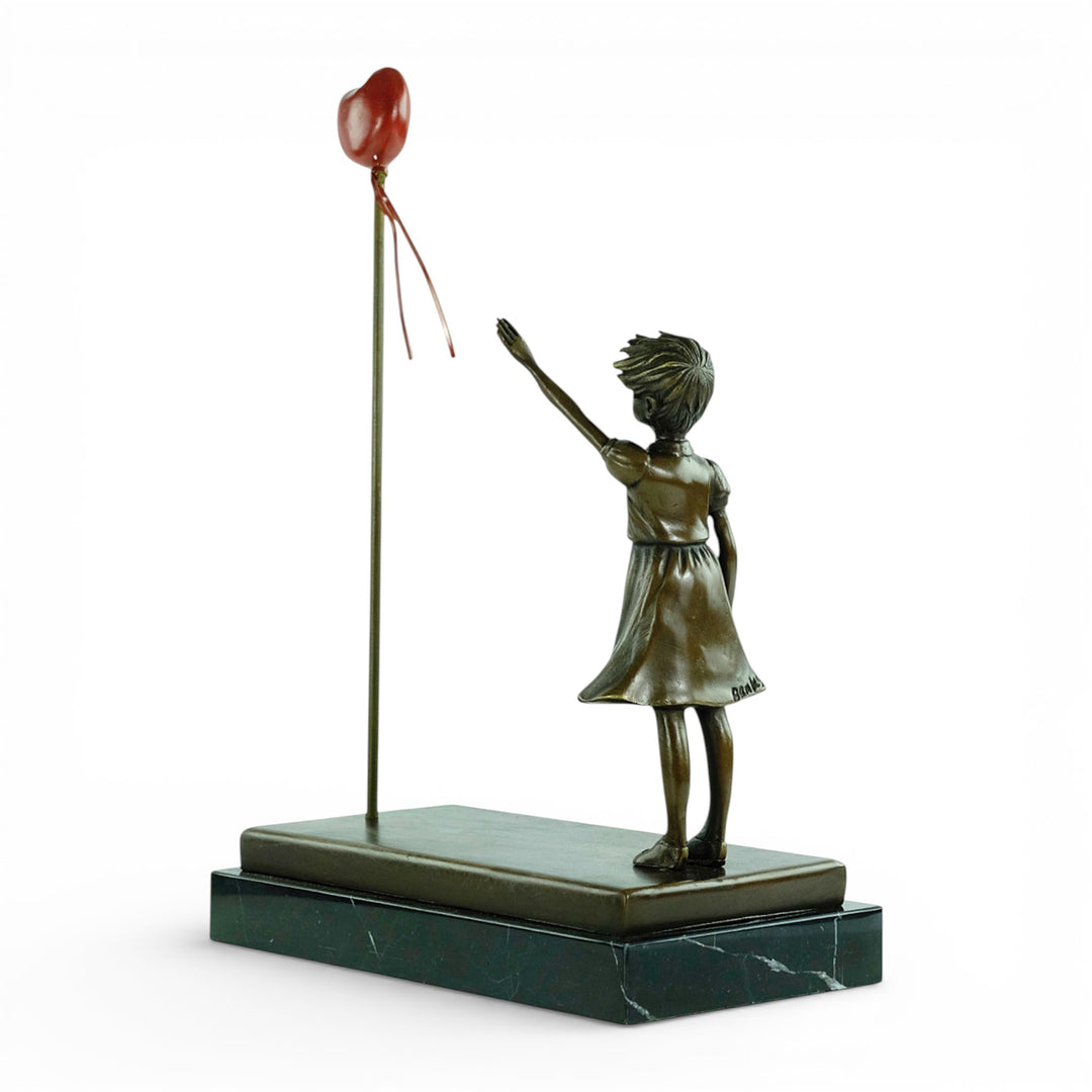 Bronze girl with balloon sculpture – inspired by Banksy
