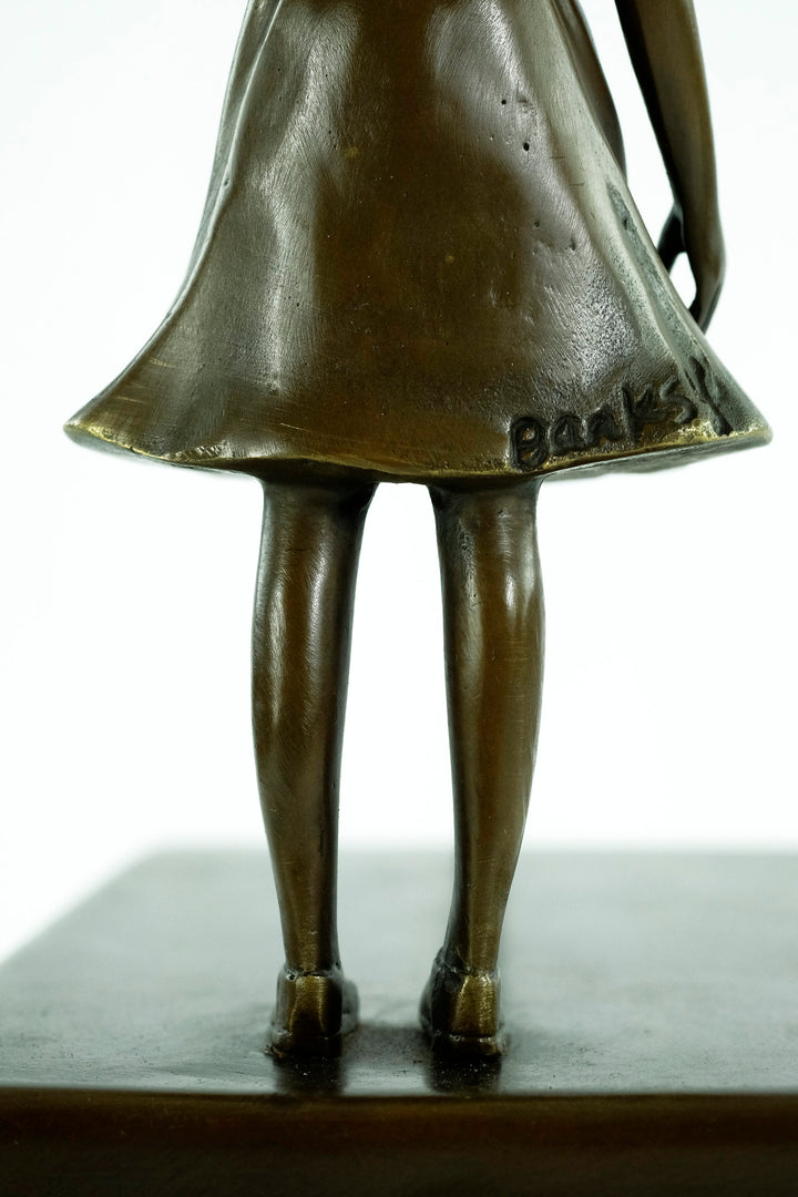 Bronze girl with balloon sculpture – inspired by Banksy