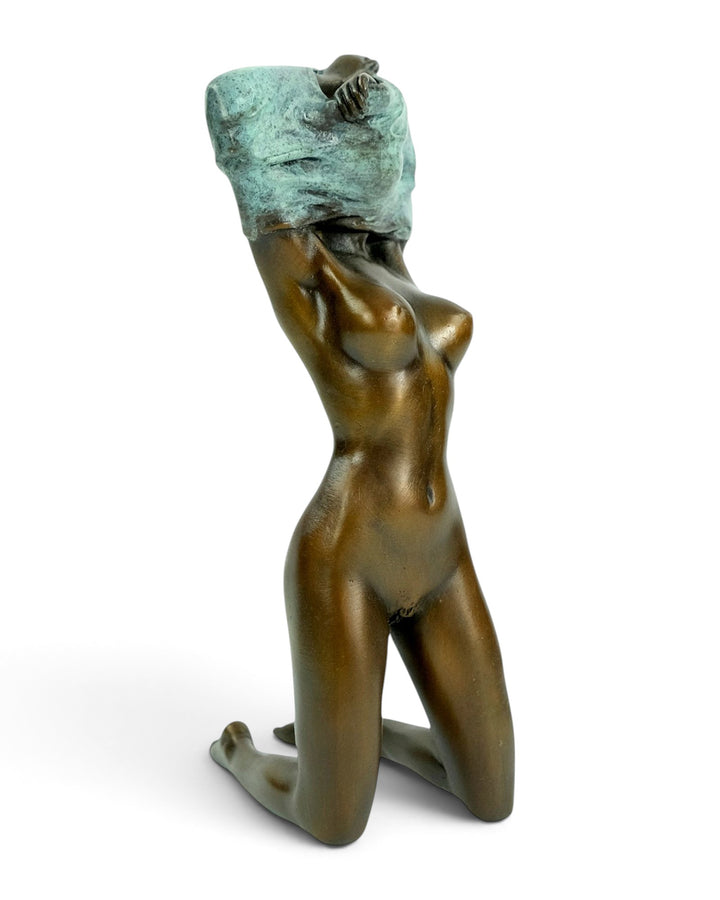 Bronze Sculpture of an Undressing Female Nude