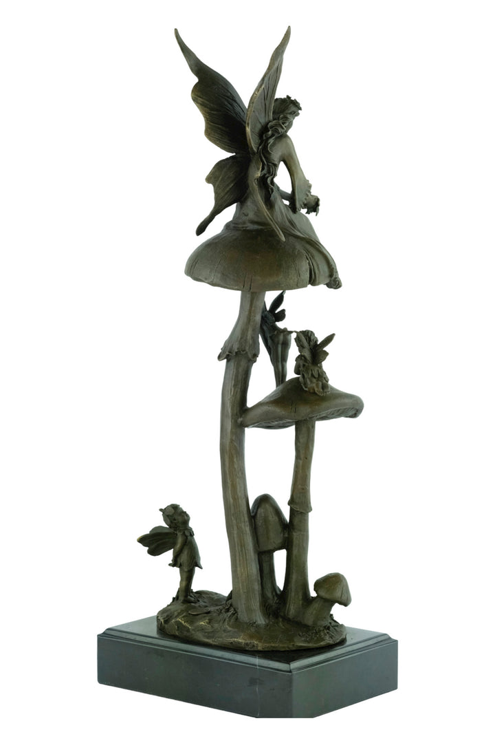 Bronze sculpture of a group of fairies sitting on mushrooms