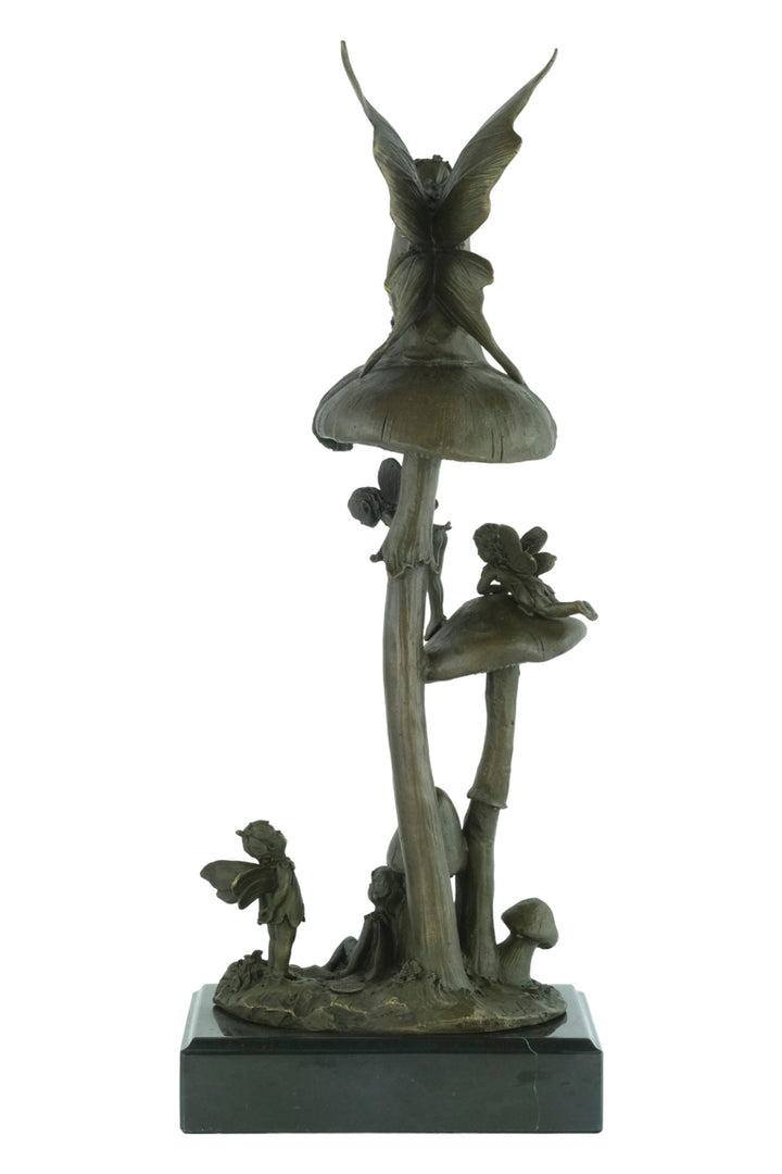 Bronze sculpture of a group of fairies sitting on mushrooms