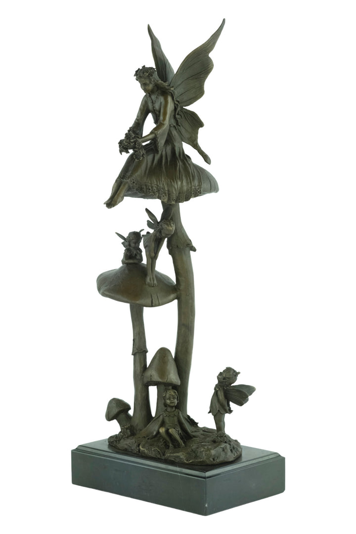 Bronze sculpture of a group of fairies sitting on mushrooms