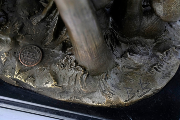 Bronze sculpture of a group of fairies sitting on mushrooms