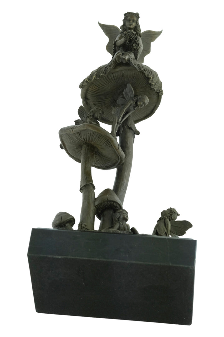 Bronze sculpture of a group of fairies sitting on mushrooms