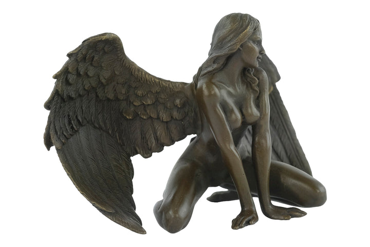 Bronze sculpture of a winged female nude leaning forward