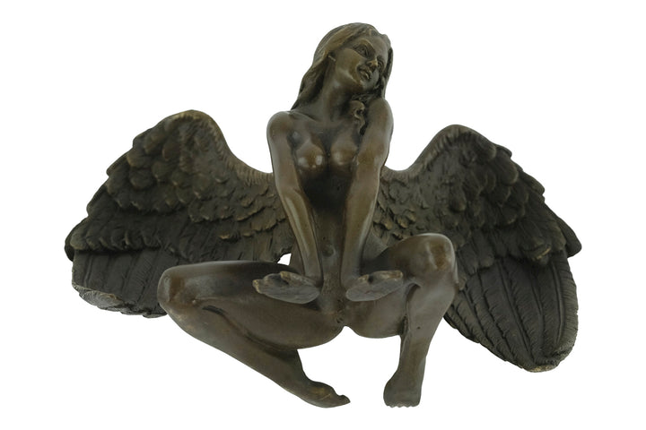 Bronze sculpture of a winged female nude leaning forward