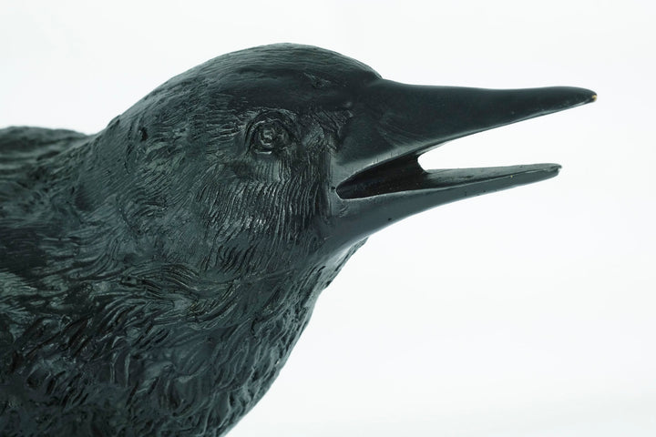 Lifesize bronze sculpture of a raven female