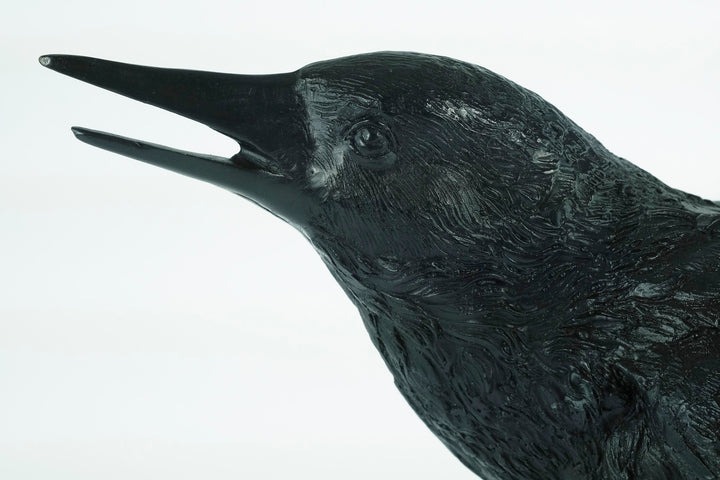 Lifesize bronze sculpture of a raven female