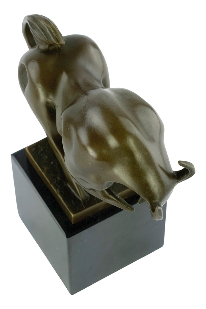 Modern bronze sculpture of a charging bull