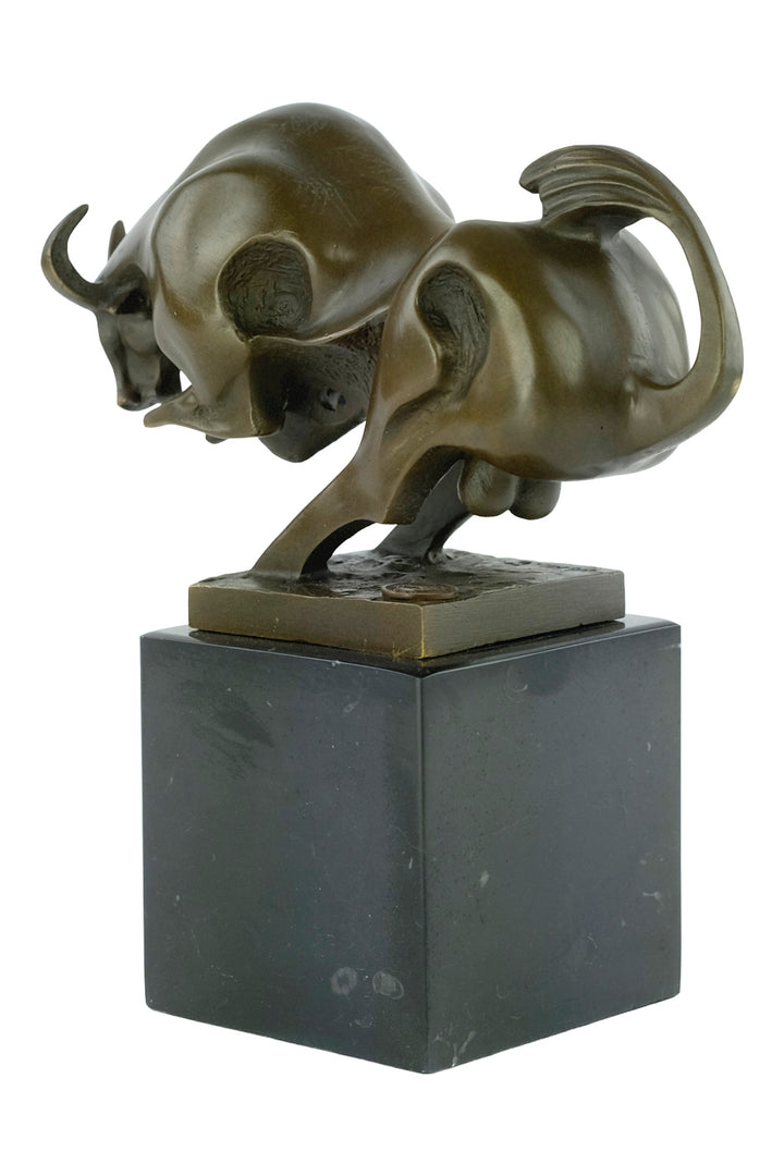 Modern bronze sculpture of a charging bull