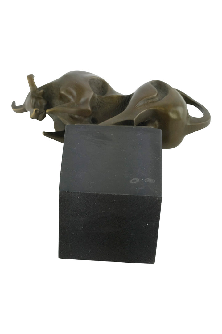 Modern bronze sculpture of a charging bull