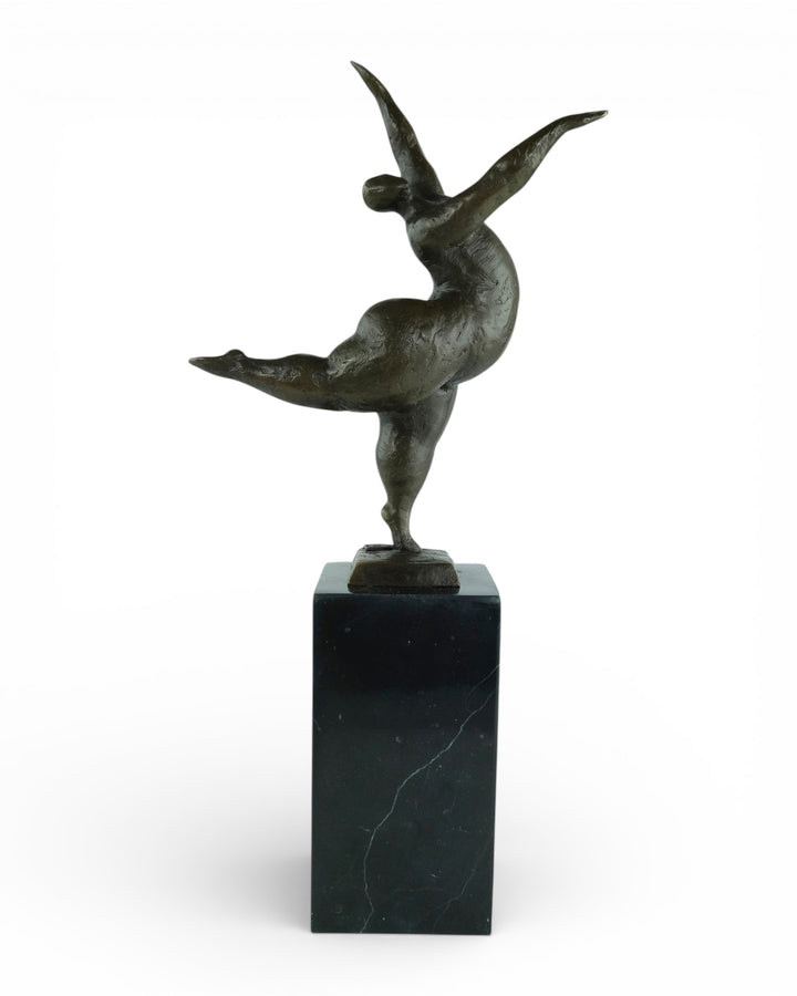 Bronze sculpture of a voluptuous female nude dancing freely