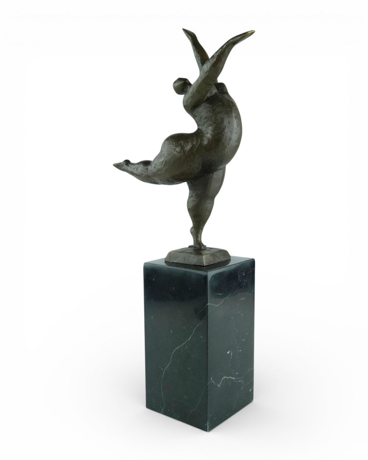 Bronze sculpture of a voluptuous female nude dancing freely
