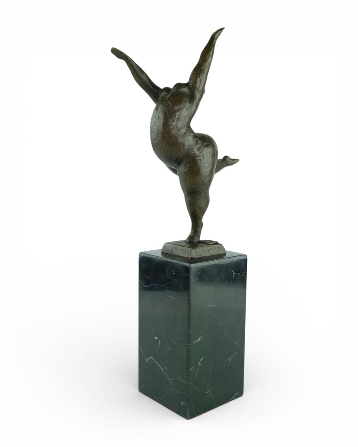 Bronze sculpture of a voluptuous female nude dancing freely