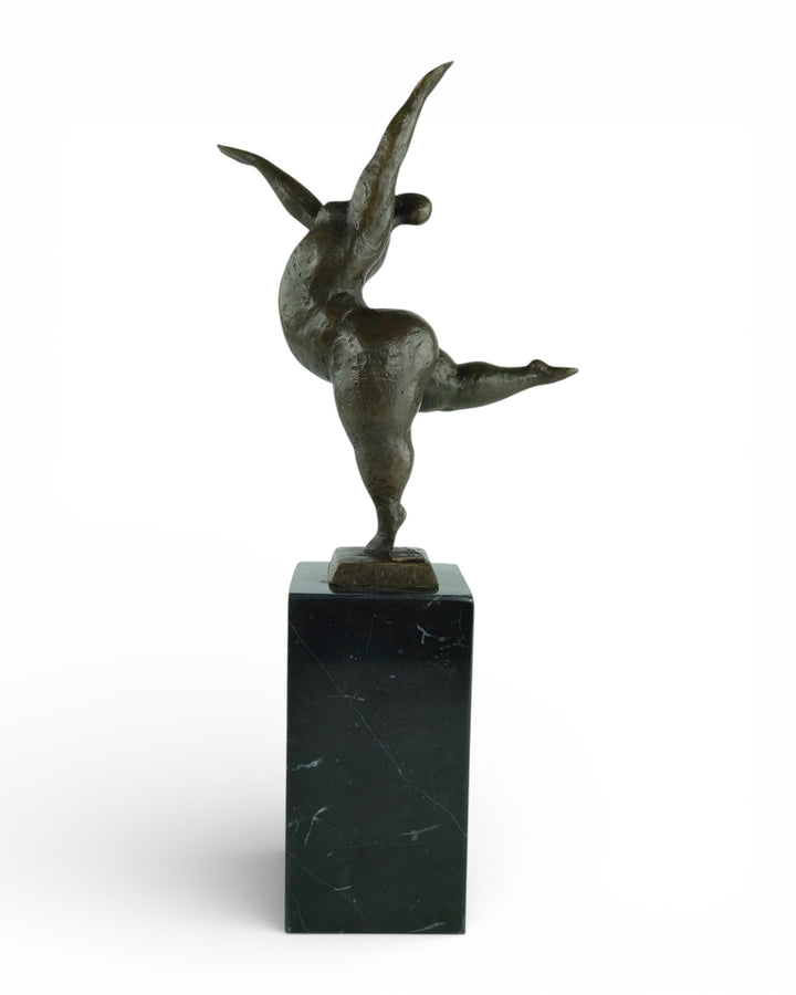 Bronze sculpture of a voluptuous female nude dancing freely