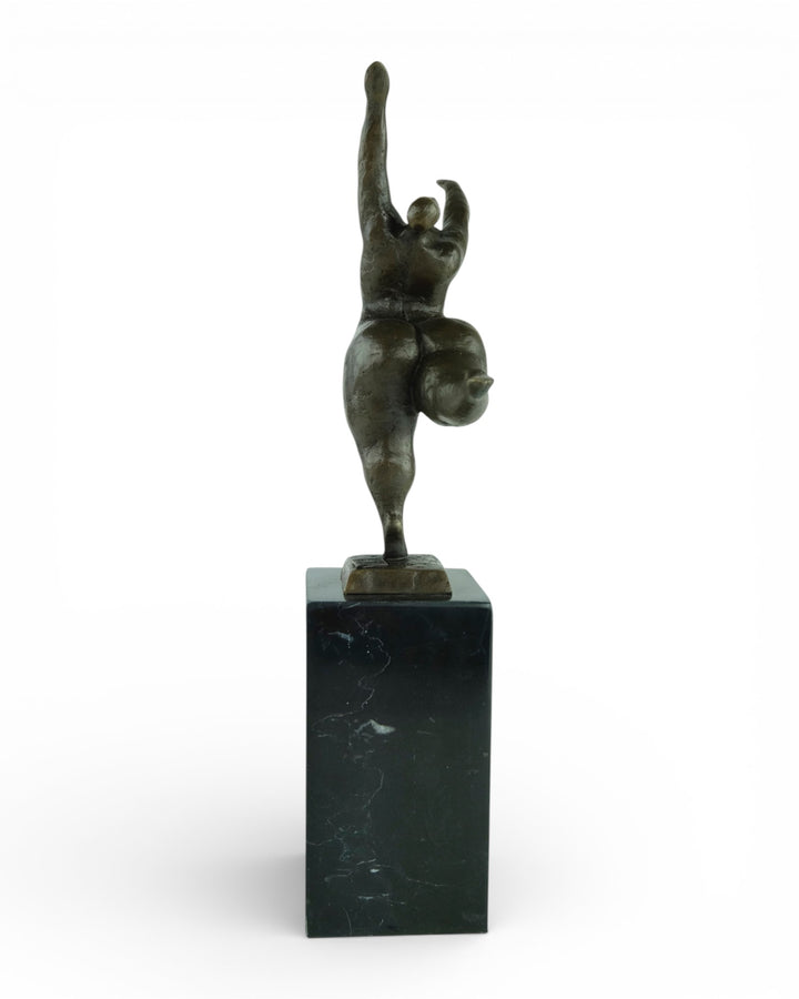 Bronze sculpture of a voluptuous female nude dancing freely