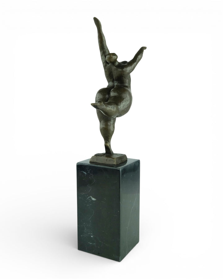 Bronze sculpture of a voluptuous female nude dancing freely