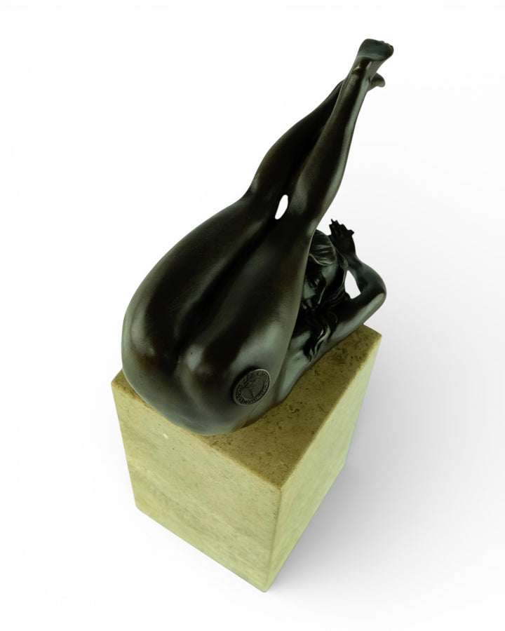 Bronze sculpture of a female in flowing pose