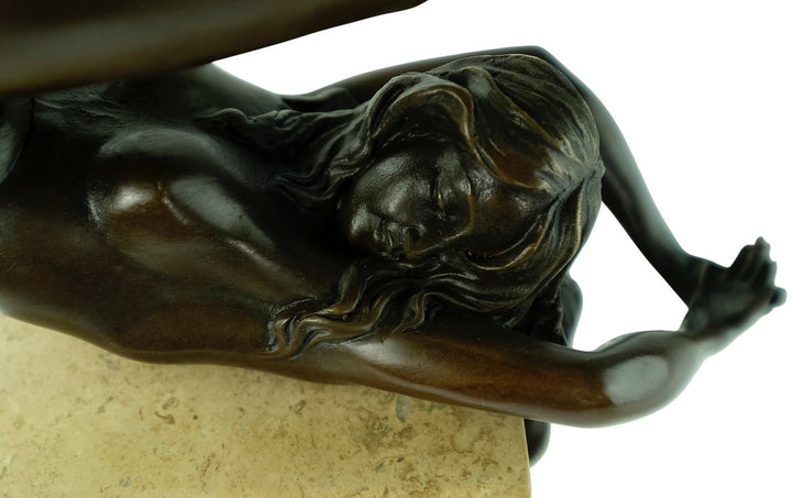 Bronze sculpture of a female in flowing pose