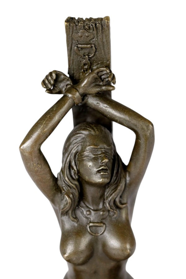 Erotic bronze sculpture of a blindfolded female chained to a pole