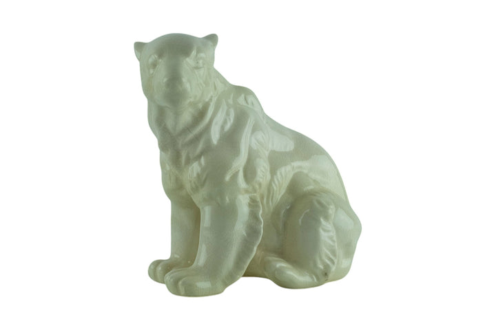 Porcelain sculpture of a sitting polar bear