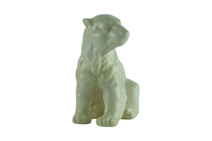 Porcelain sculpture of a sitting polar bear