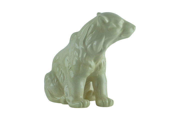 Porcelain sculpture of a sitting polar bear