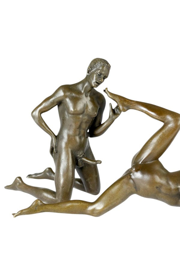 Bronze sculpture of a male and female couple having sex