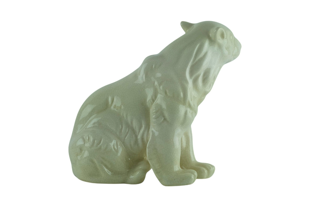 Porcelain sculpture of a sitting polar bear