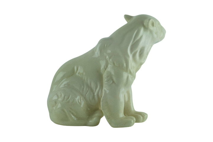 Porcelain sculpture of a sitting polar bear