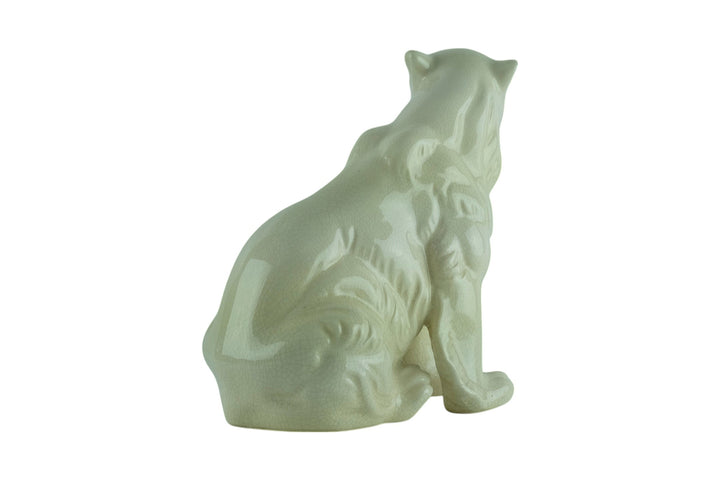 Porcelain sculpture of a sitting polar bear