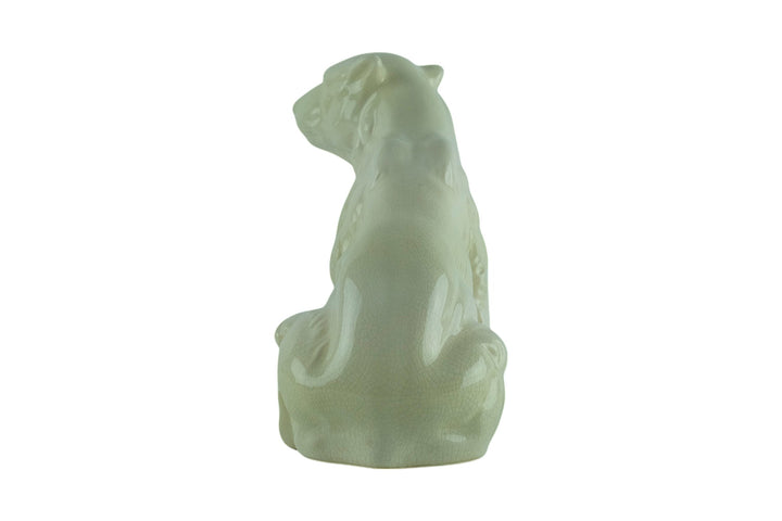 Porcelain sculpture of a sitting polar bear
