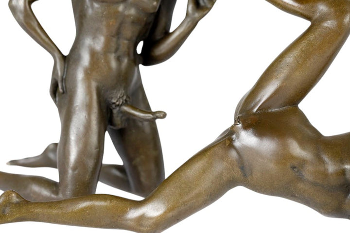 Bronze sculpture of a male and female couple having sex