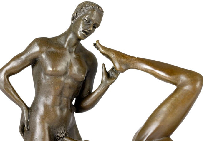 Bronze sculpture of a male and female couple having sex
