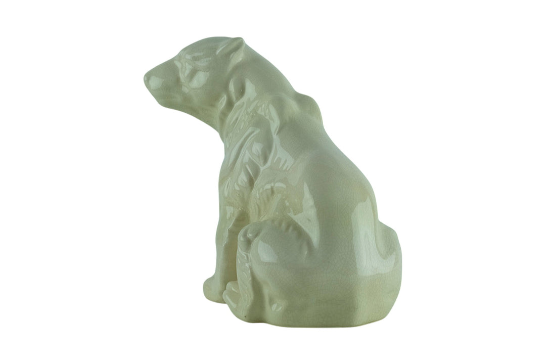 Porcelain sculpture of a sitting polar bear