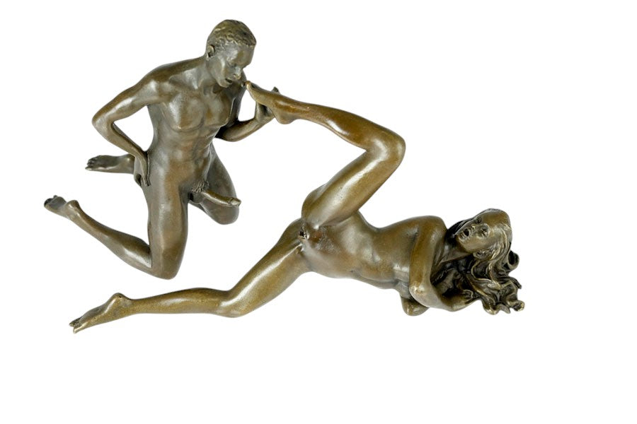 Bronze sculpture of a male and female couple having sex