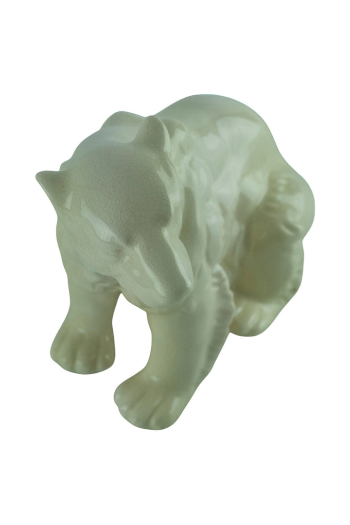 Porcelain sculpture of a sitting polar bear