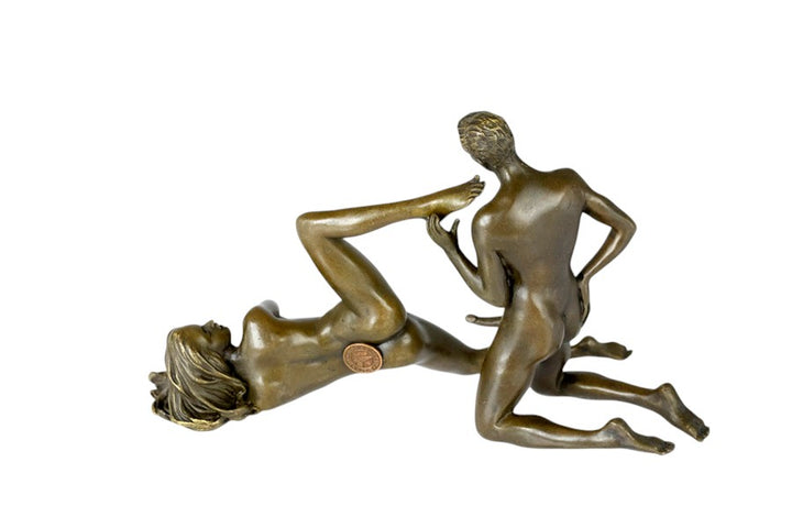 Bronze sculpture of a male and female couple having sex