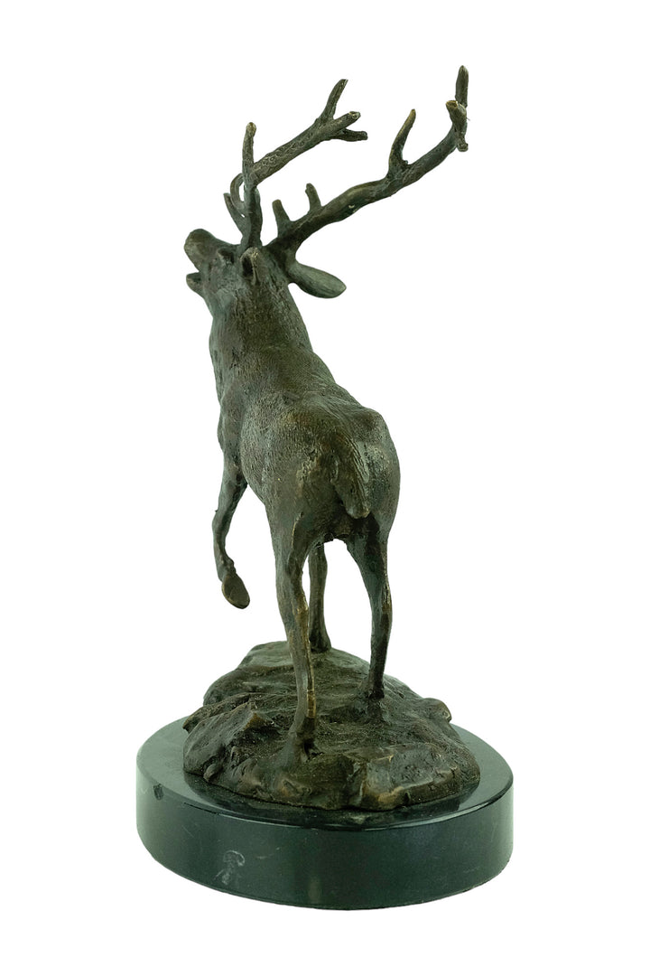 Bronze sculpture of a red deer bellowing