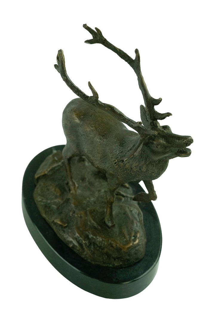 Bronze sculpture of a red deer bellowing
