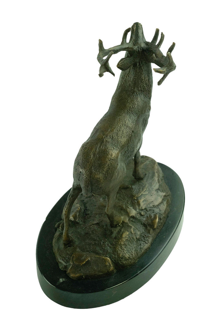 Bronze sculpture of a red deer bellowing