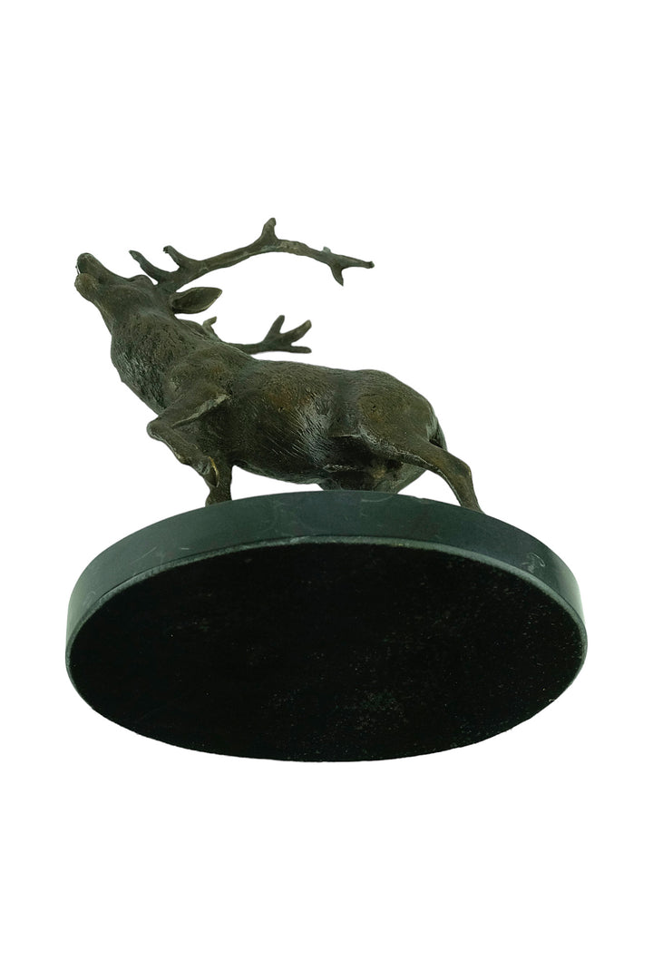 Bronze sculpture of a red deer bellowing