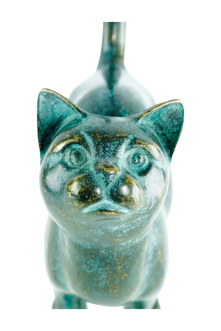 Bronze sculpture of a cat with lifted tail
