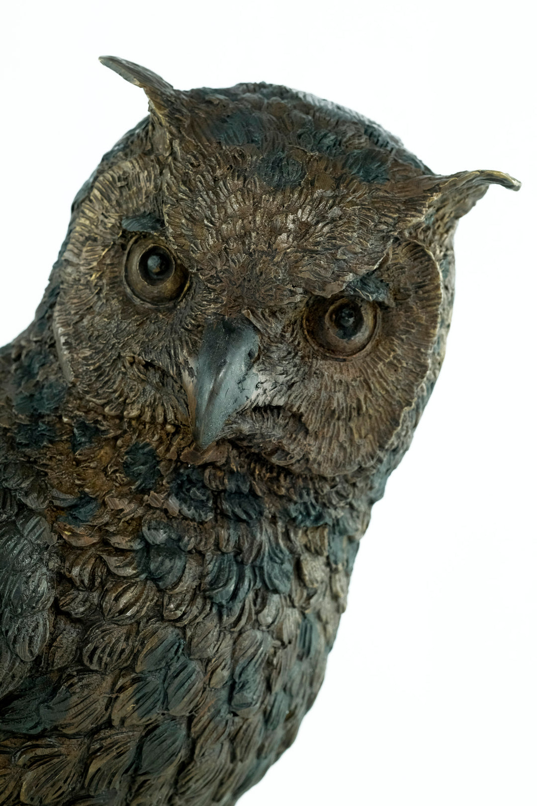 Bronze sculpture of a standing owl