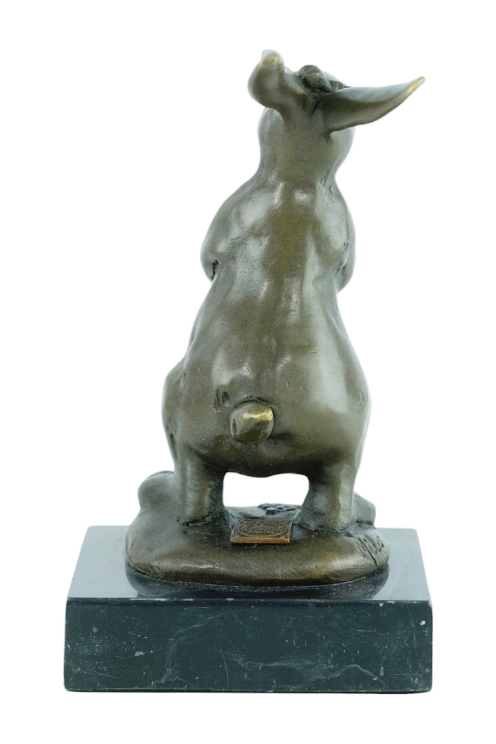 Bronze sculpture of a bunny with a flower basket